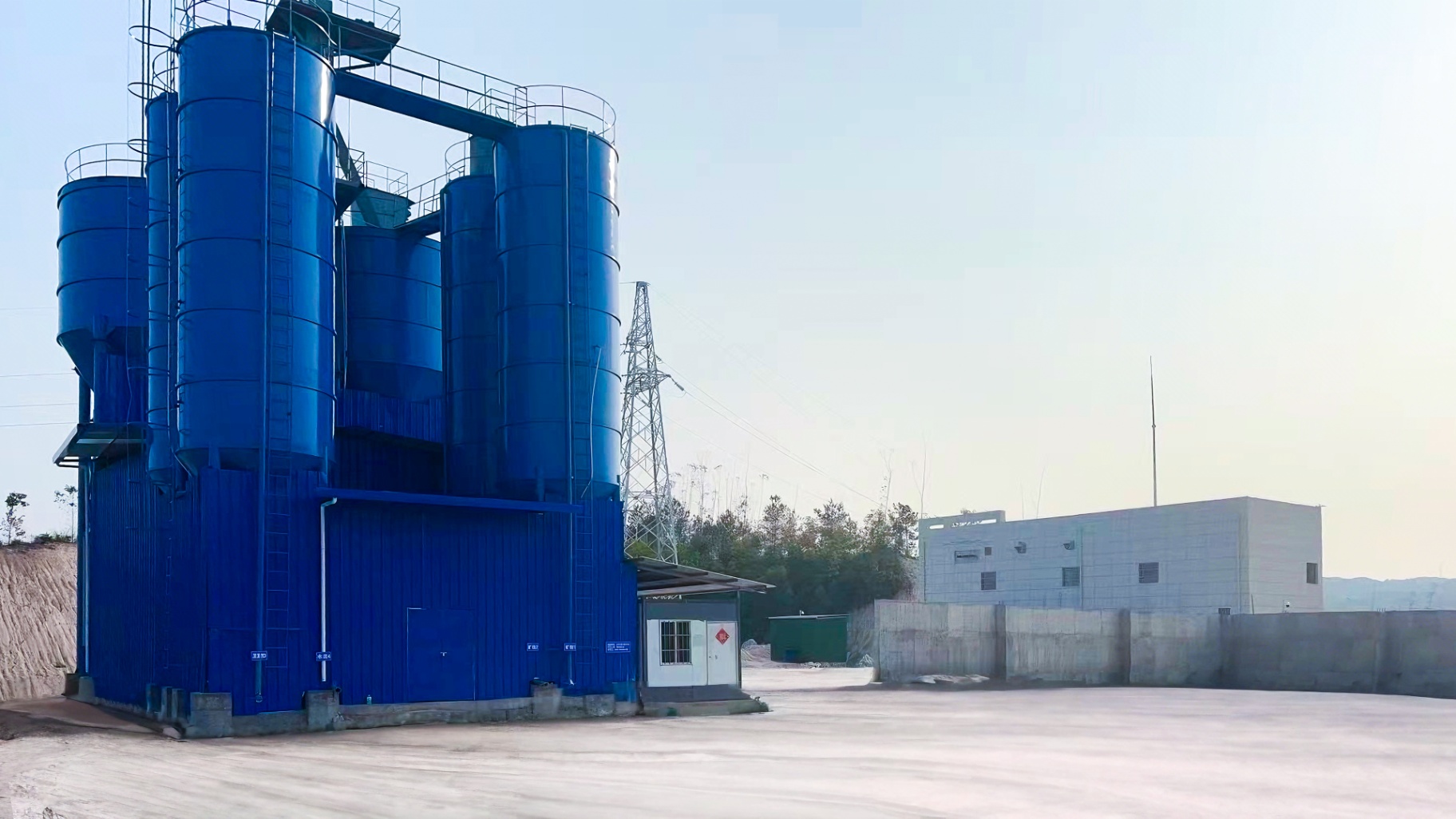 Blue silos in the factory yard